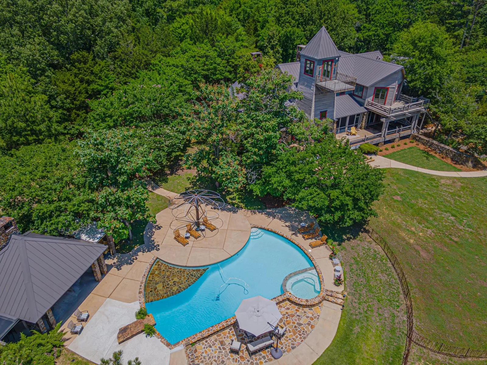 Luxury Mississippi home and swimming pool viewed from above