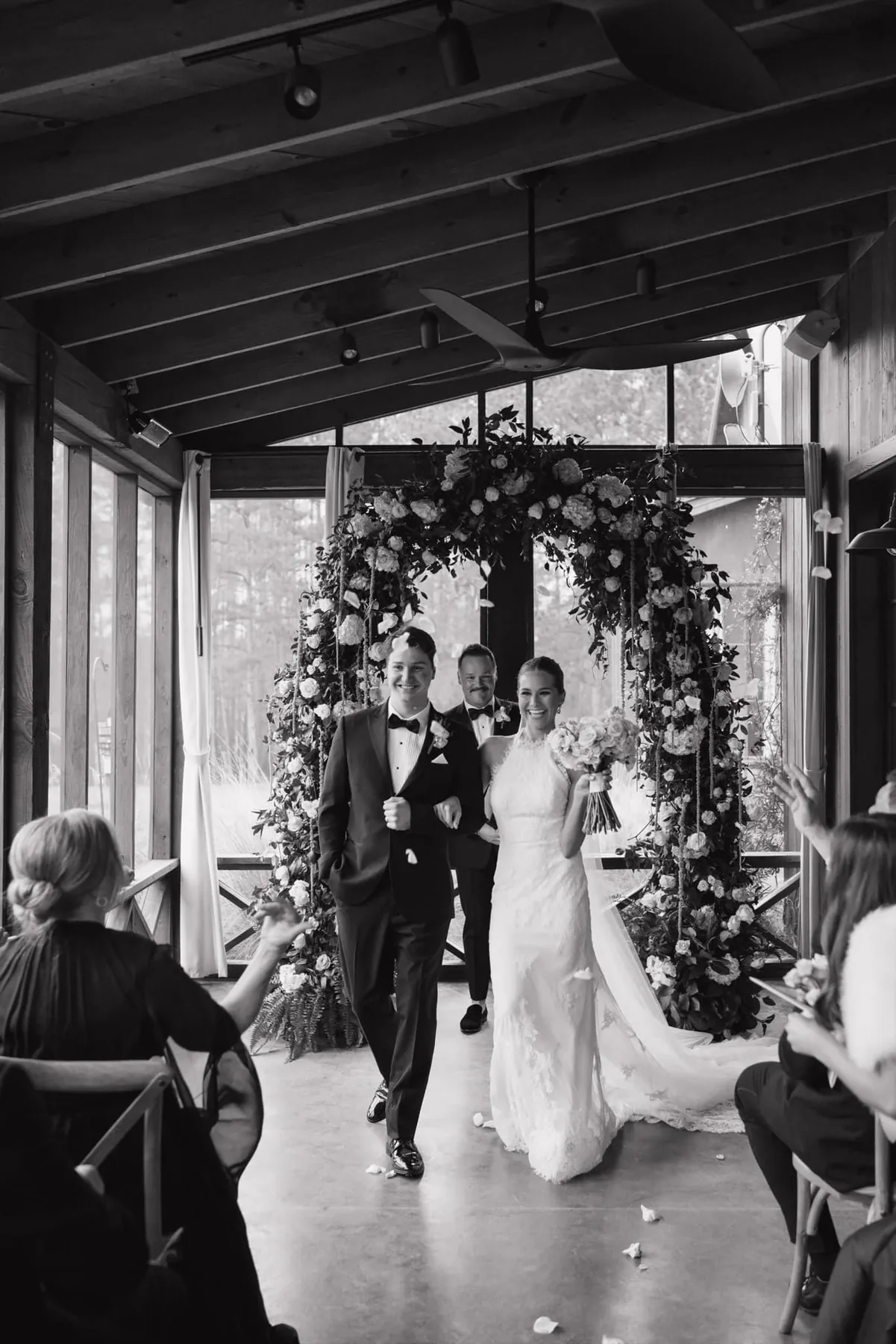 JP and Hailey Clark leaving their wedding ceremony